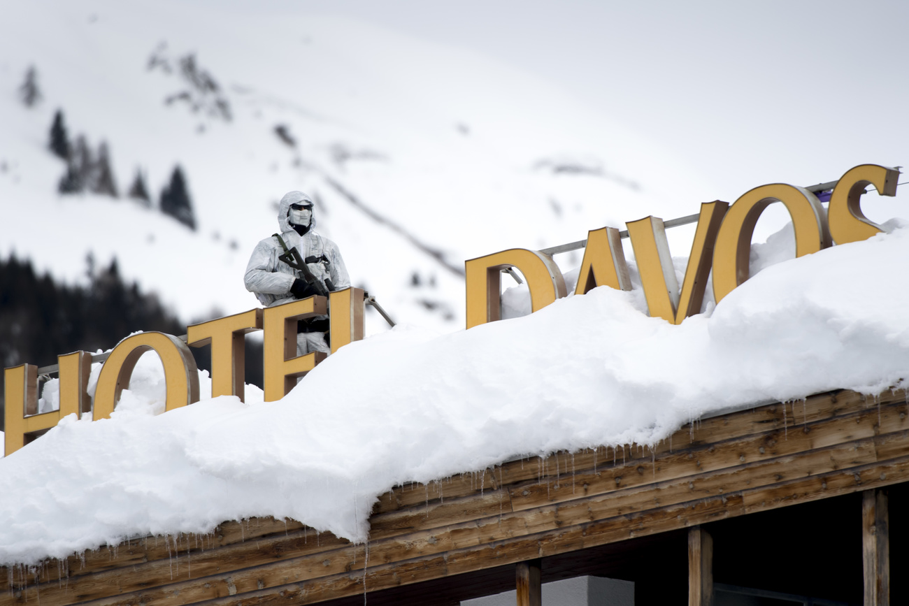 Swiss special forces guards building in Davos for WEF meeting.