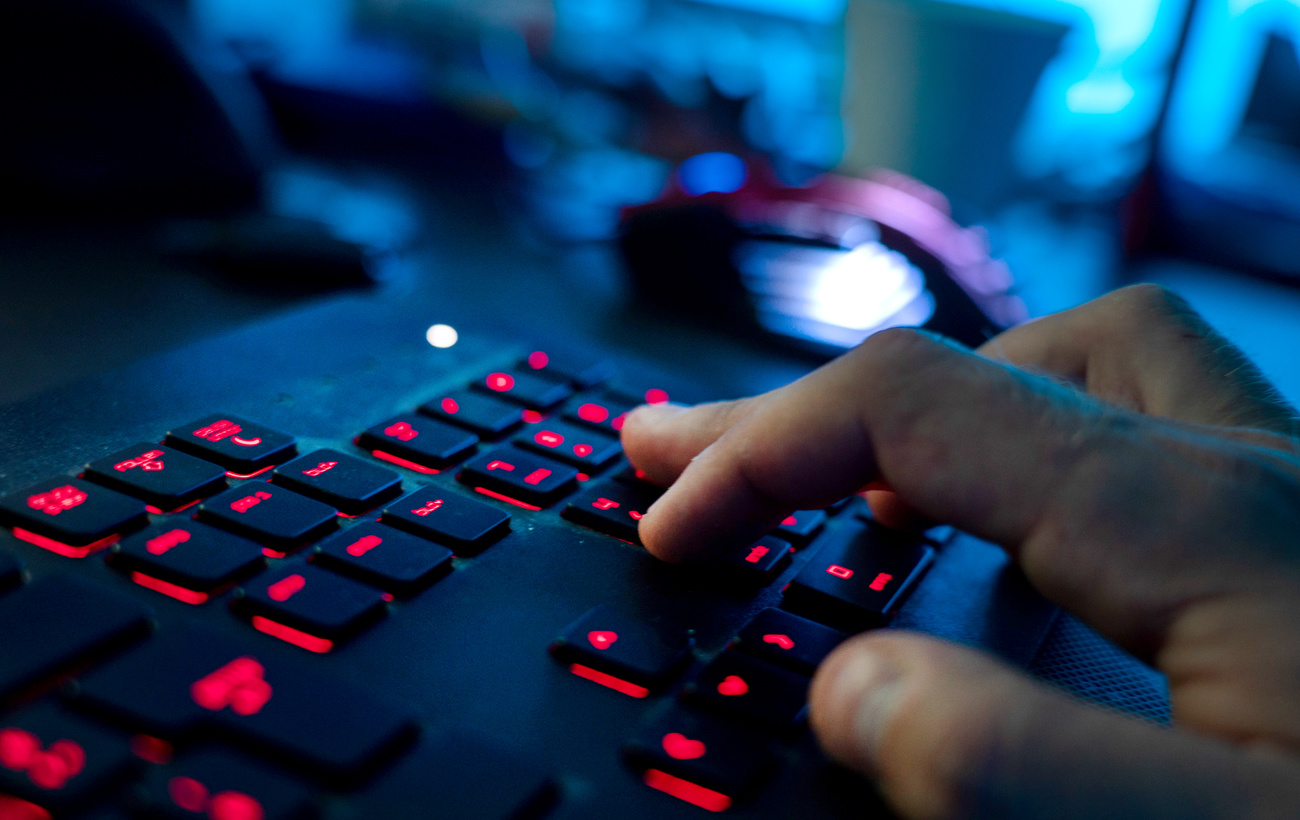 Photo of a man s hand typing on a computer