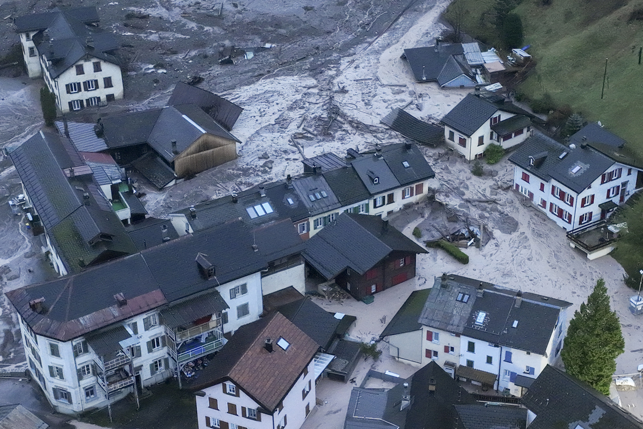 aerial view of village with landslide