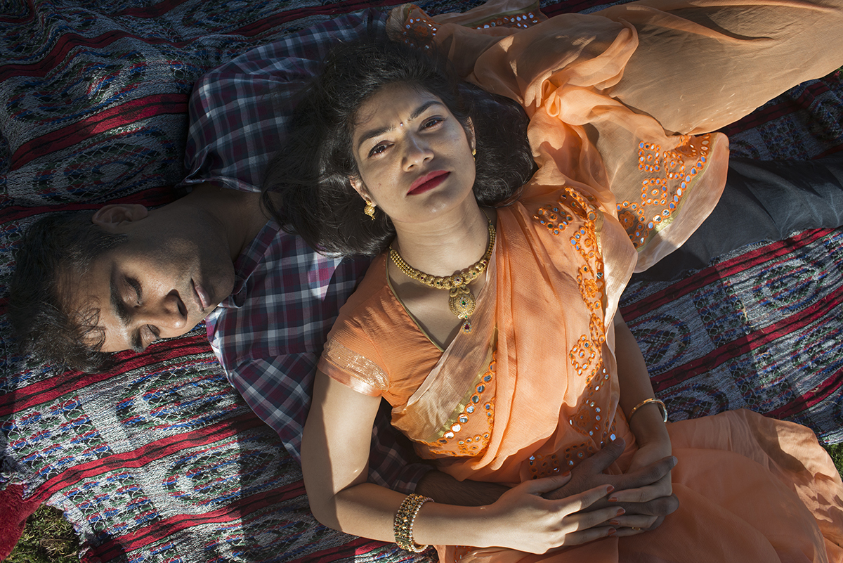 Birds-eye view of a couple lying on their backs