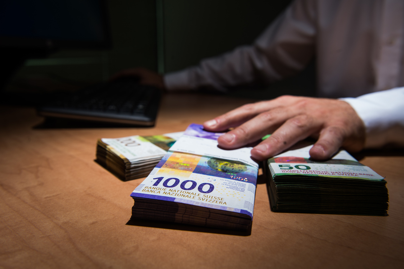 Man's hand over banknotes