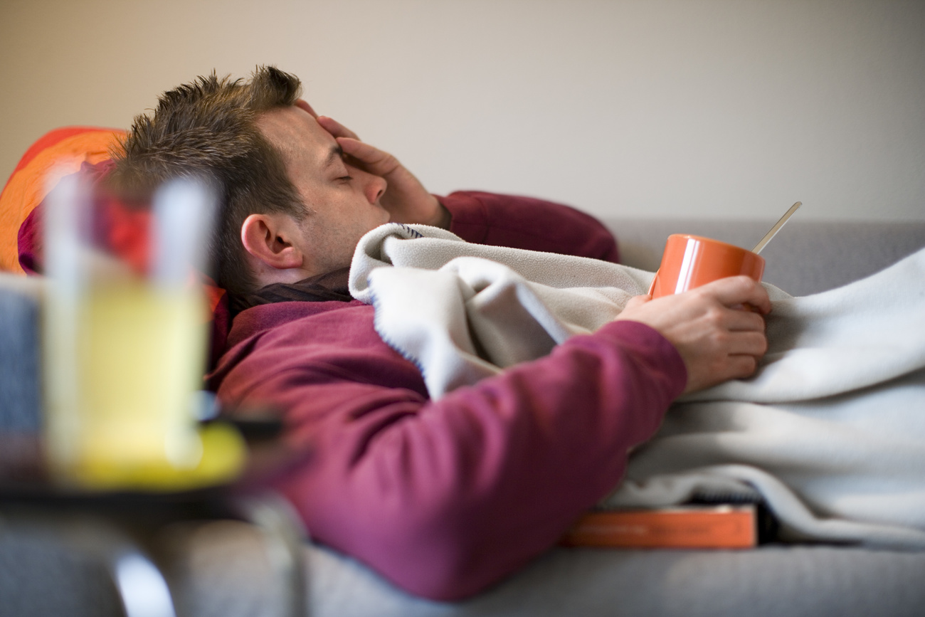Man in bed with flu