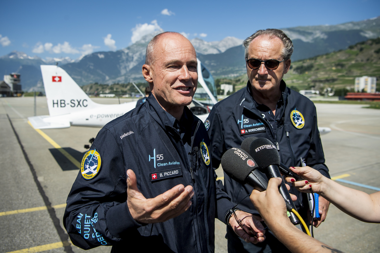 Picture of two pilots speaking to journalists