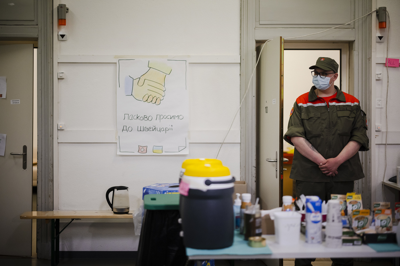 Staff is waiting at a food distribution station at the reception center for refugees, following Russia's invasion of Ukraine, in Zurich, Switzerland on March 15, 2022.