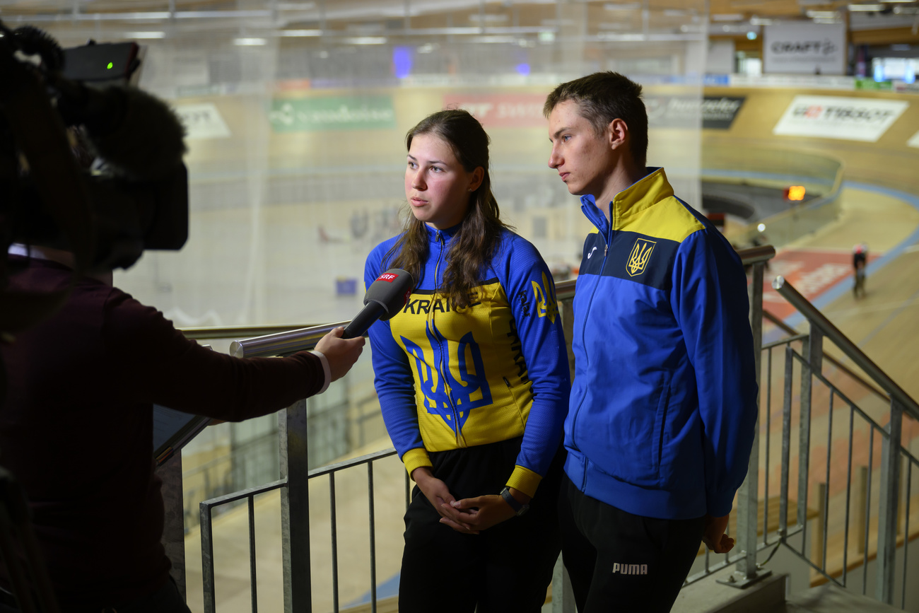 Department of Defense, Civil Protection and Sport DDPS is offering help and support to Ukrainian competitive athletes in Switzerland. Ukrainian junior track cyclists Kateryna Badiak, left, and Leonid Fomenko, right, in interview with journalists after a press conference at the Velodrome in Grenchen, Switzerland, March, 2022.