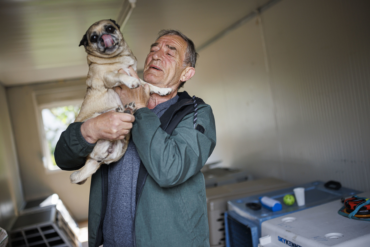 Ressi with his pug dog at a shelter for refugees from Ukraine, run by the Vaudois migrant reception establishment (EVAM).