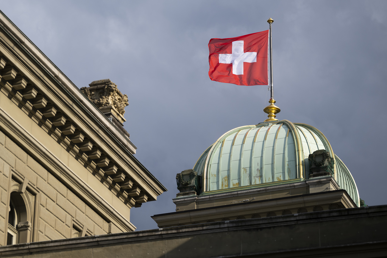 Swiss flag on building.
