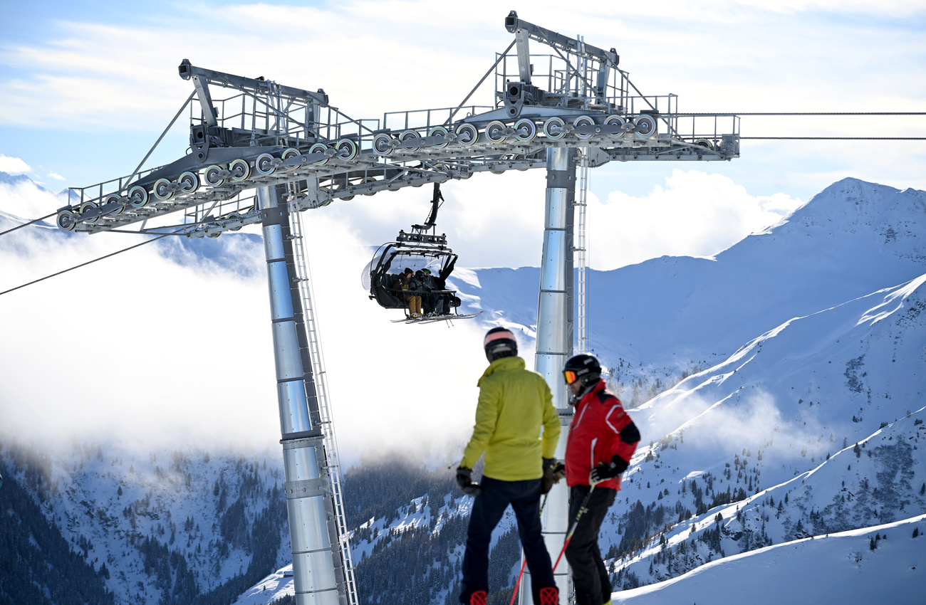 skiers by a ski lift