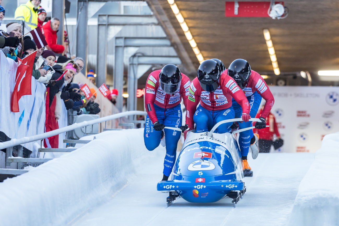 athletes competing in a bobsleigh race