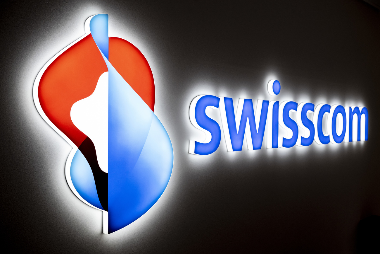 Photo of Swisscom logo over black screen