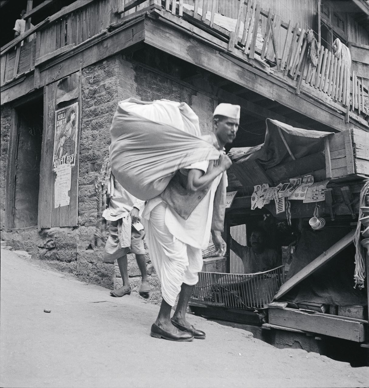Simla area, man carrying sack cloth