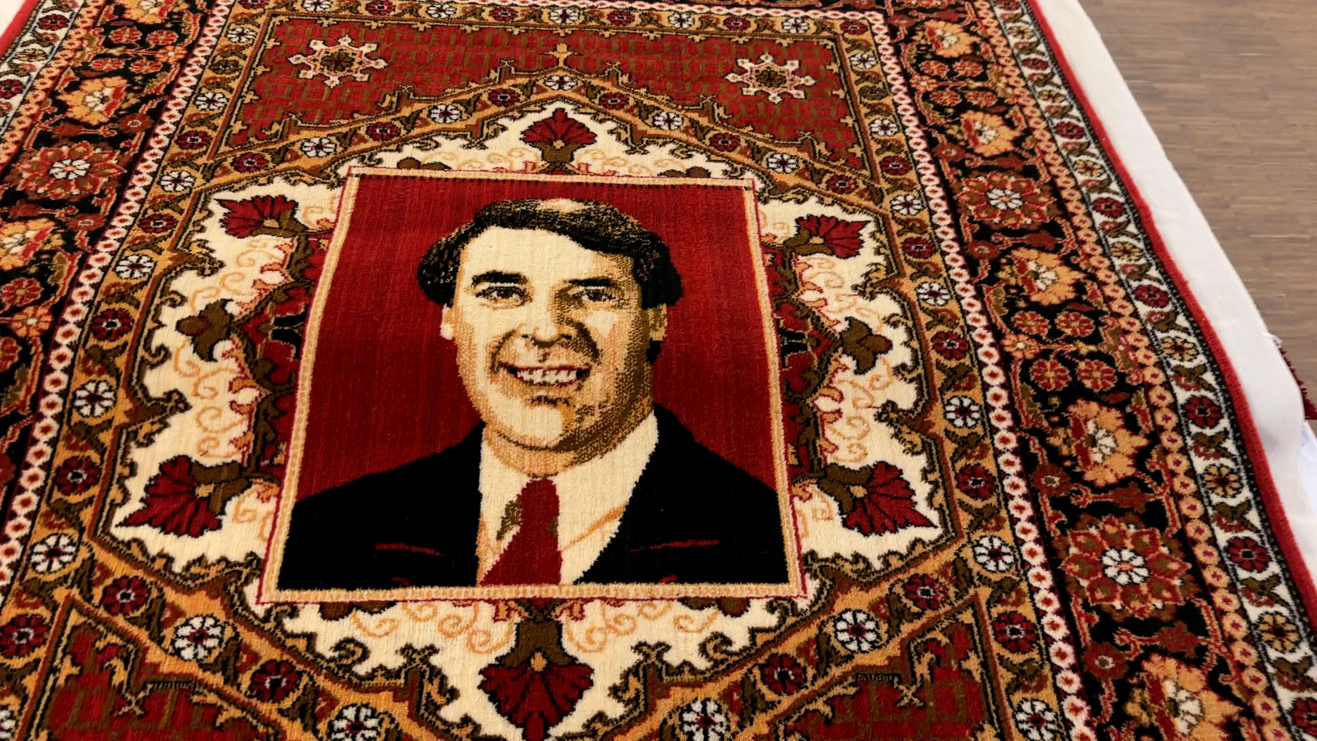 Carpet depicting former Swiss defence/transport minister Adolf Ogi, received from the President of Uzbekistan