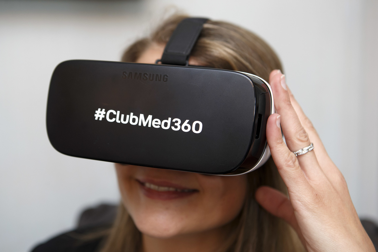 Person wearing Club Med virtual reality goggles