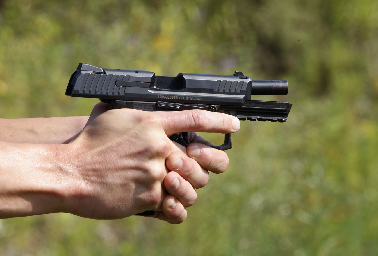 Person firing a pistol