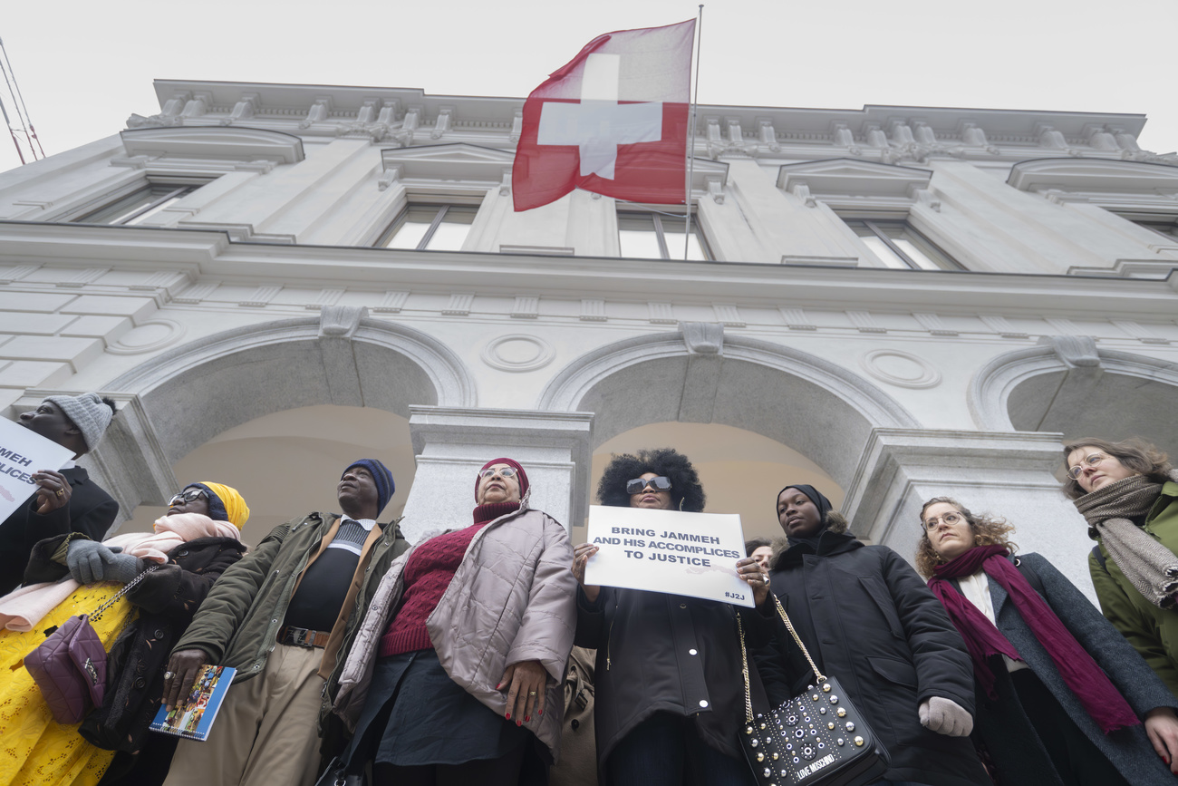 Protestors demand justice against Sonko outside the Swiss court.