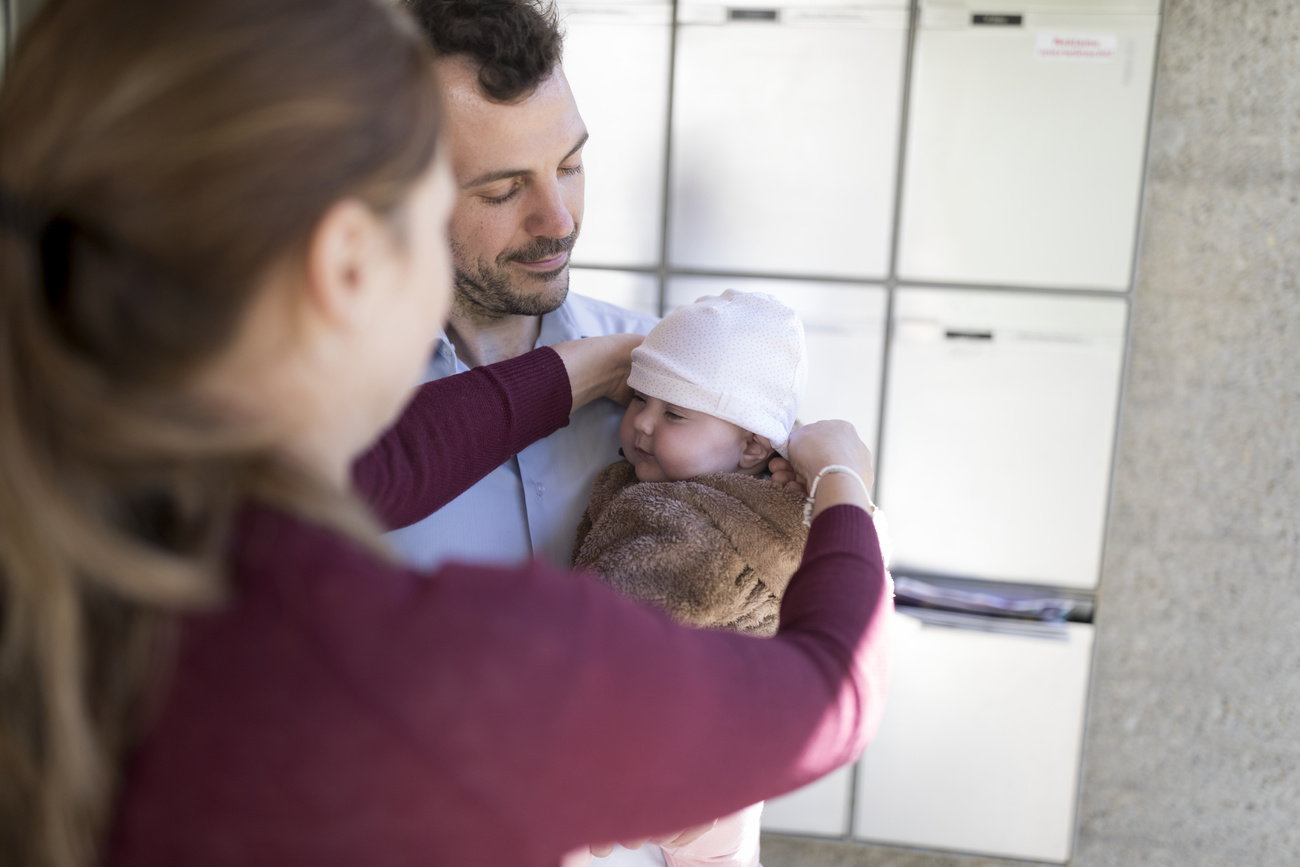 Eine Frau, ein Mann und ein Baby