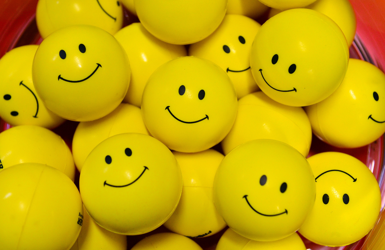 many yellow balls with happy smileys