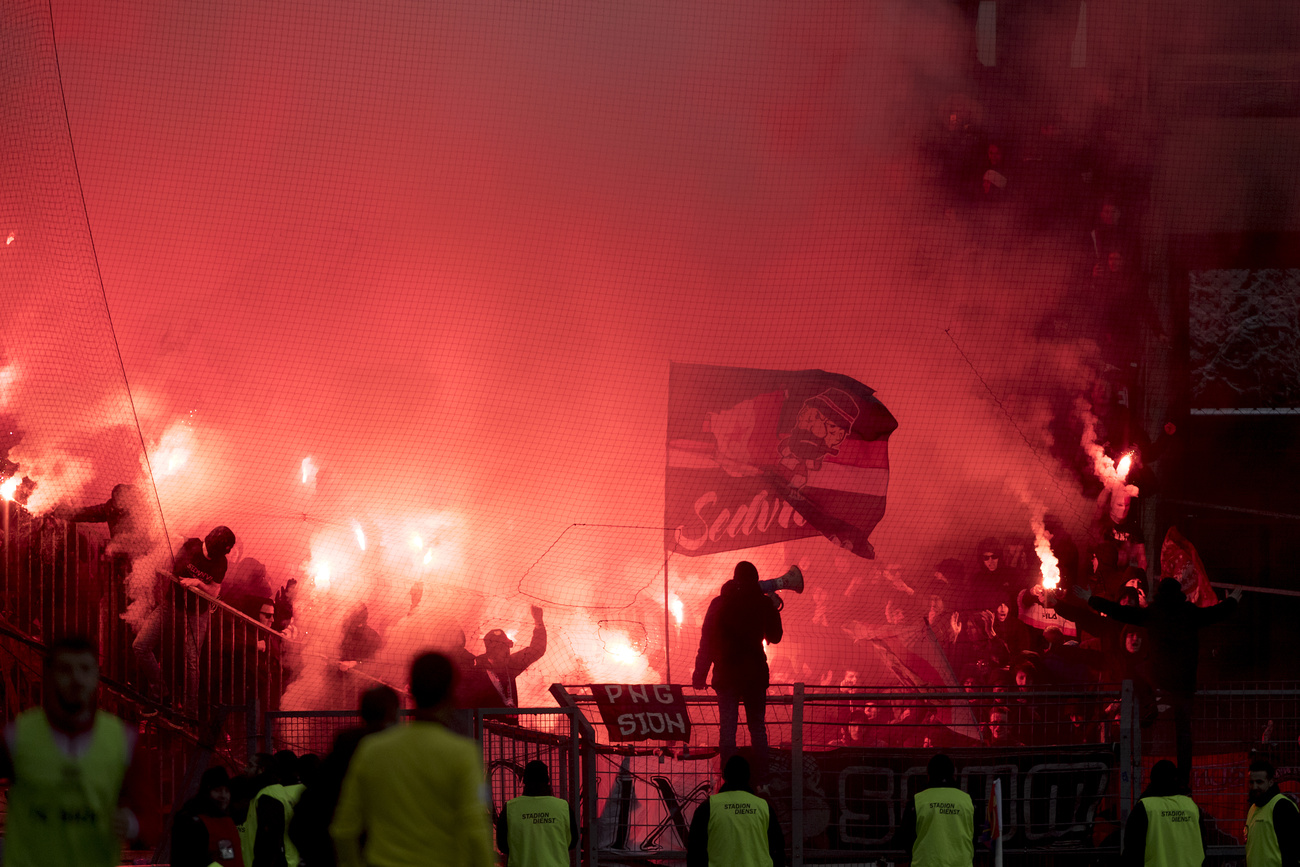 Sion fans light flares in the stadium at the start of the second half during the Super League football championship match between FC Basel 1893 and FC Sion at the St. Jakob-Park stadium in Basel