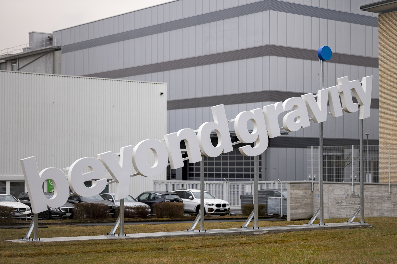 white logo "beyond gravity" slanted to look like it is taking off.