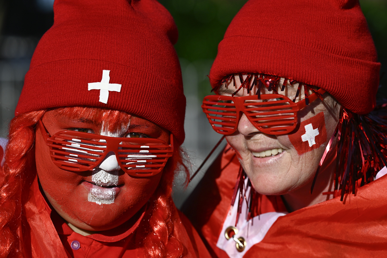 Swiss supporters pose for a photo ahead of the Women's World Cup.