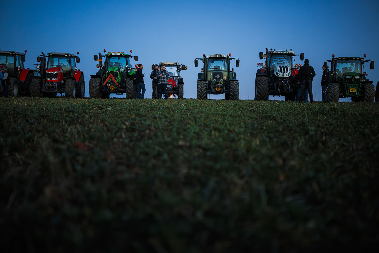 tractors in dim light