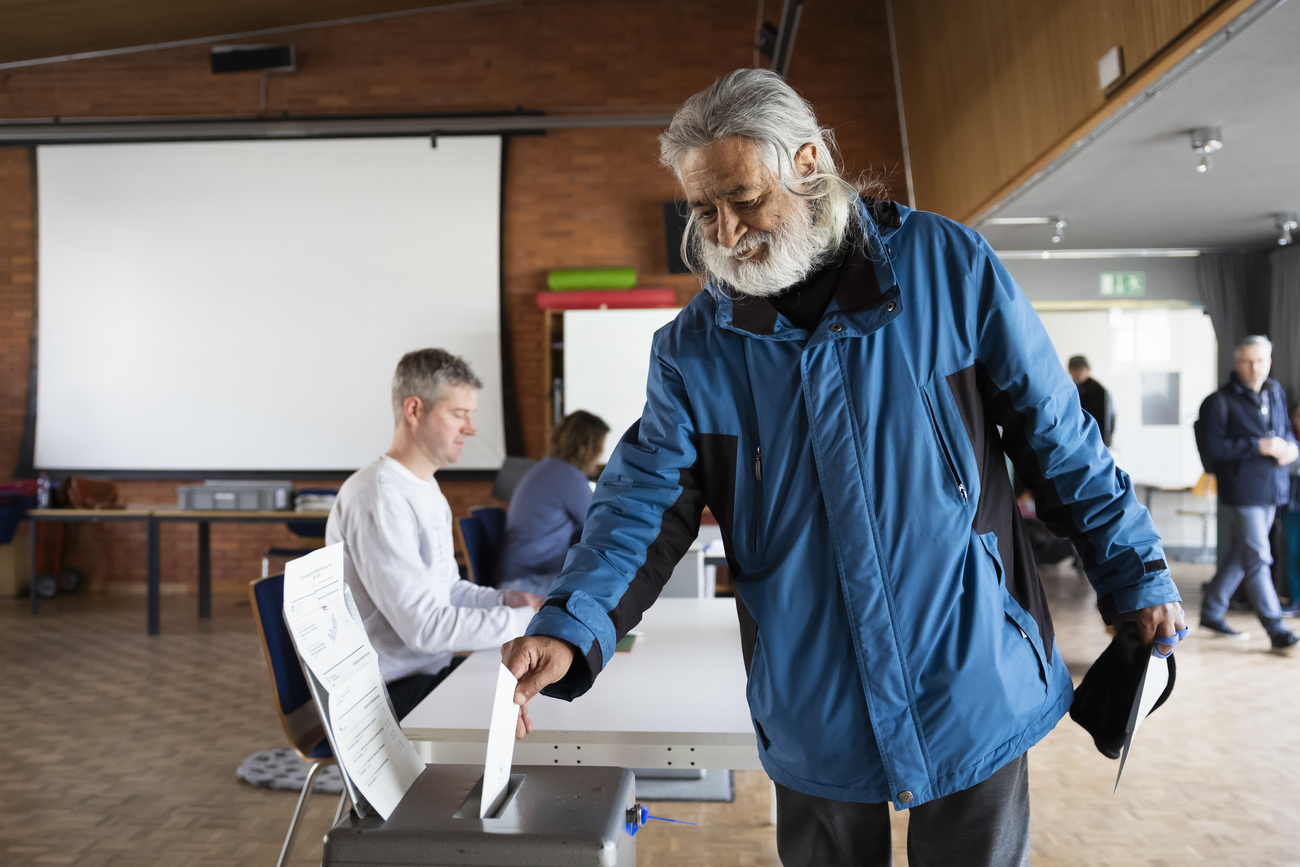 Man voting in Switzerland.