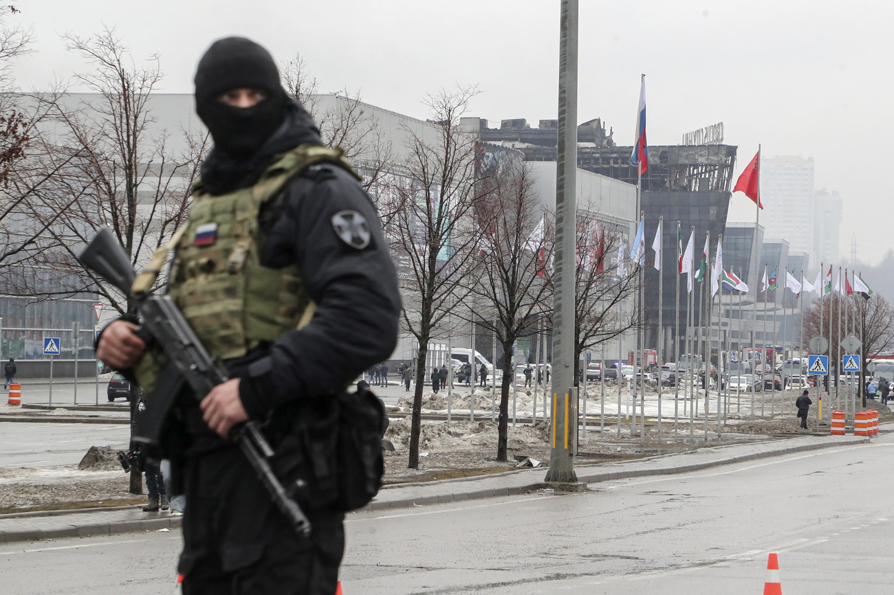 A policeman guards the burned Crocus City Hall concert venue following a terrorist attack in Krasnogorsk, outside Moscow, Russia, on March 23, 2024.