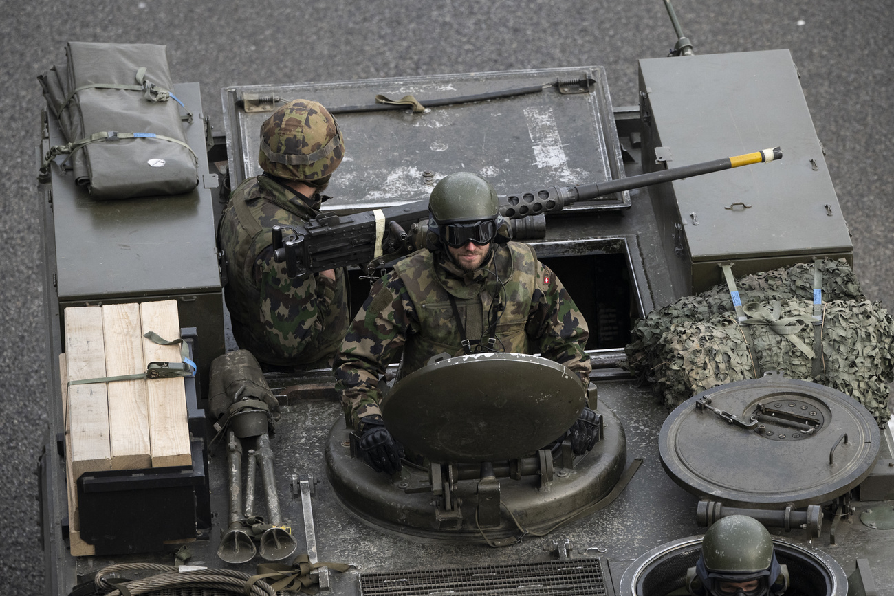 Swiss soldiers in armoured vehicle