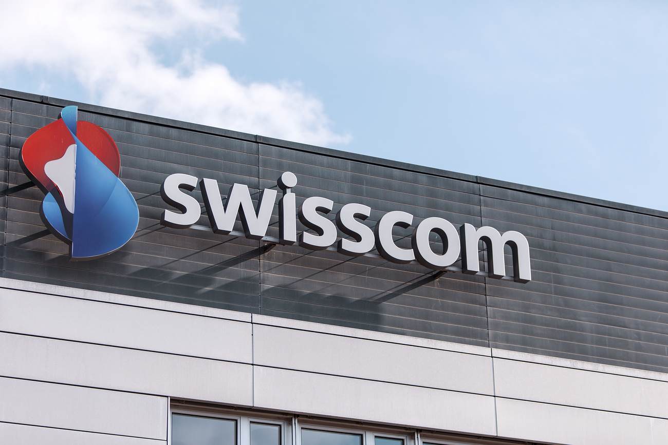 The logo of Swiss telecommunications company Swisscom is displayed on a building.