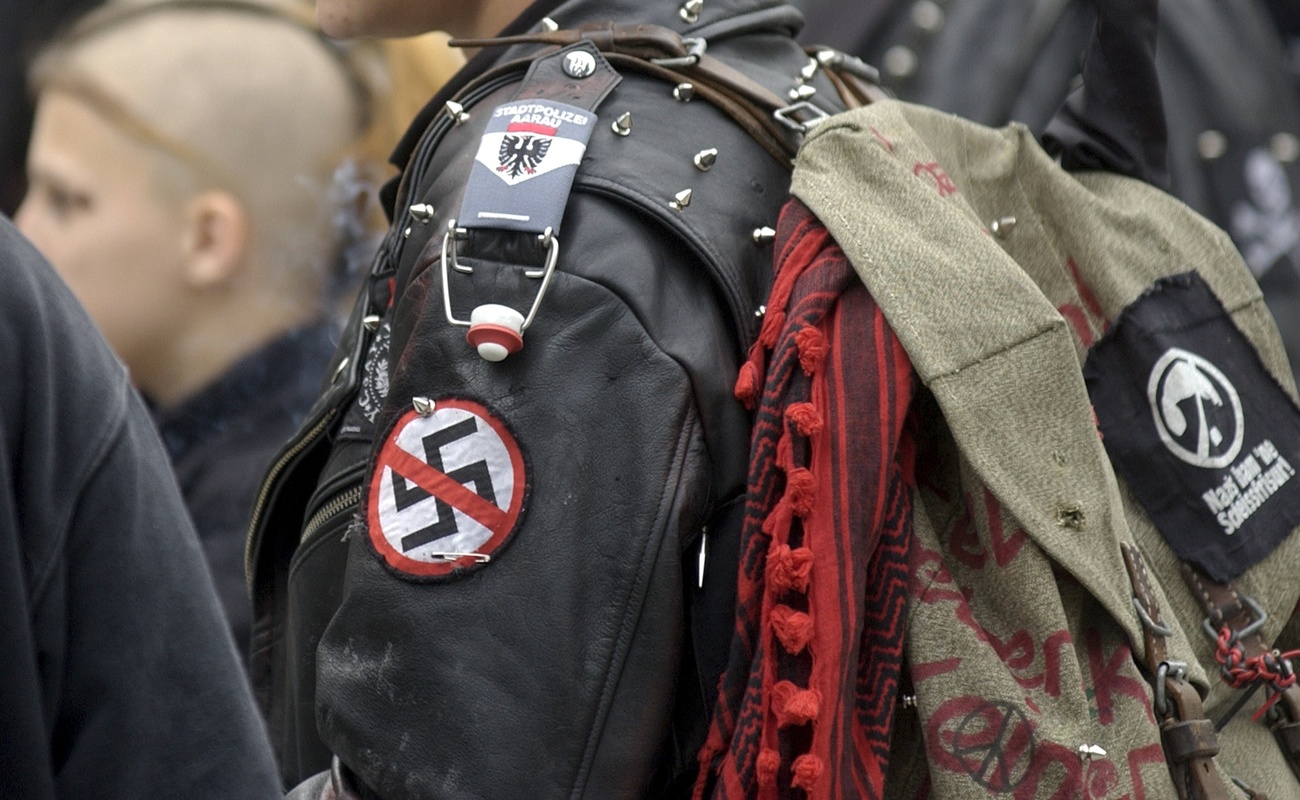 Picture of a person's jacket with symbol of ban of a swastika