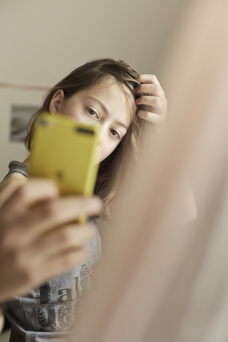 symoblic picture of girl taking selfie