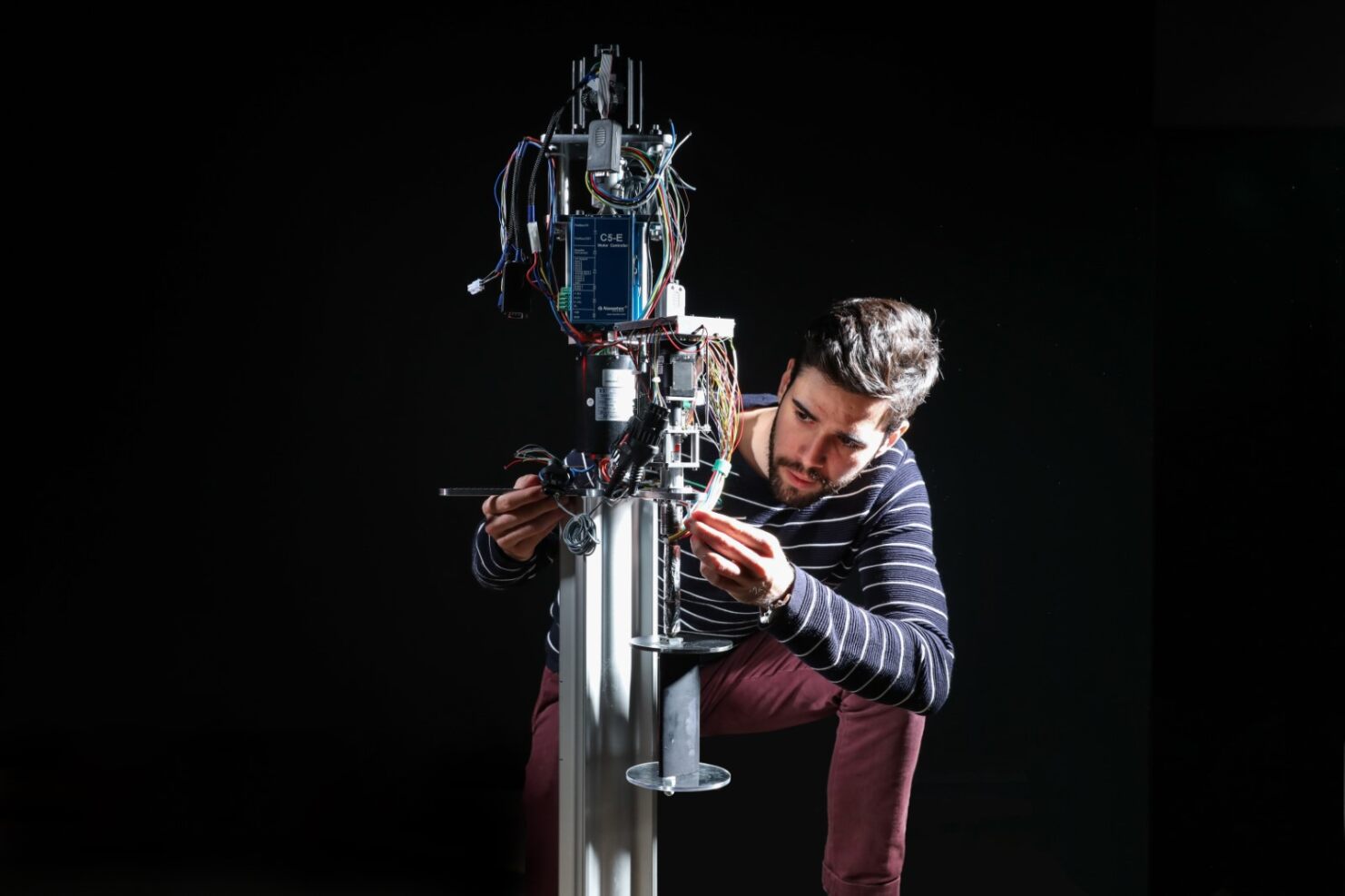 Sébastien Le Fouest with his motorised miniature vertical axis wind turbine equipped with sensors.