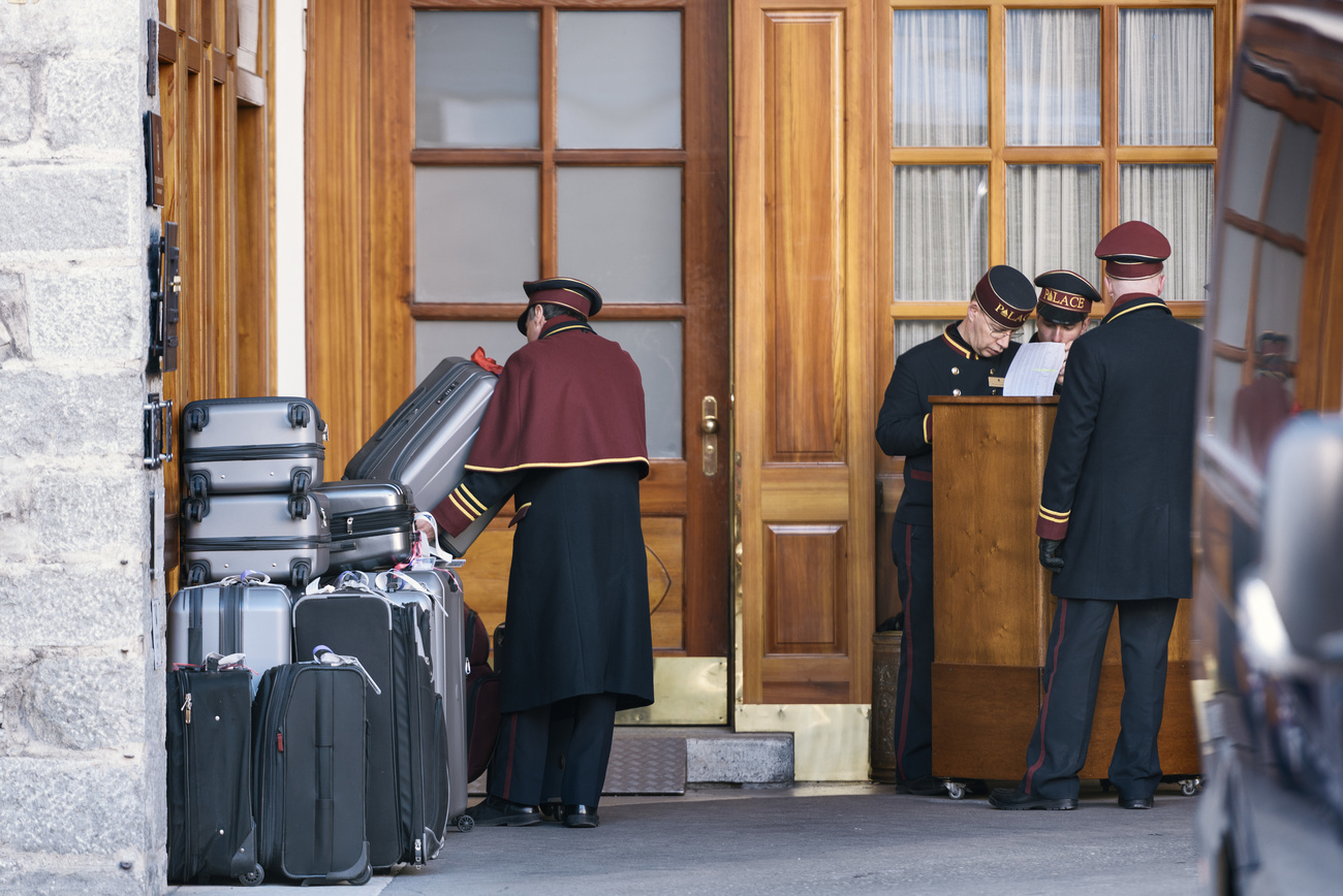 Bellhops outside the Hotel Badrutt's Palace Via Serlas in St. Moritz, Canton of Grisons, Switzerland, on March 18, 2016.