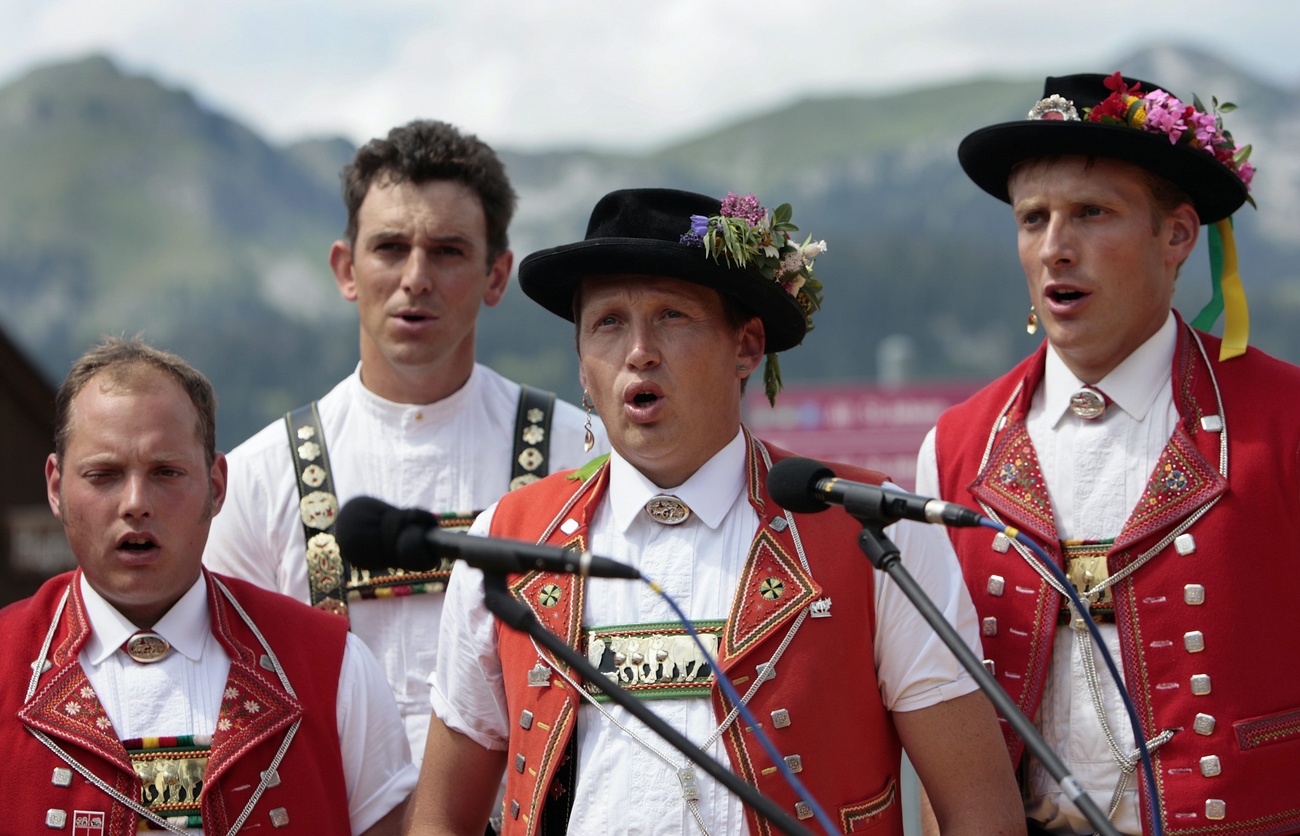 Swiss farmers wearing the traditional costume sing together