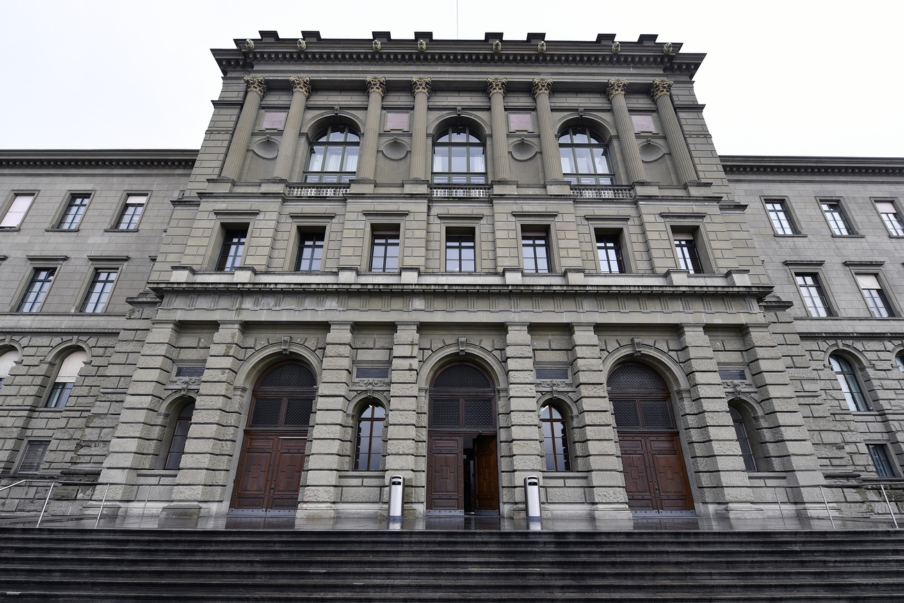 The grand grey stone facade of ETH Zurich, as seen from a low angle looking up