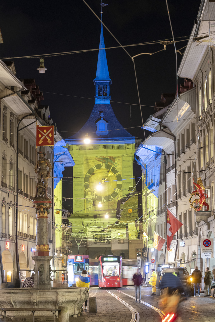 The “Zytglogge” in Bern city is illuminated in the Ukrainian national colours to mark the anniversary of the outbreak of war in Ukraine, on Friday, February 24, 2023.