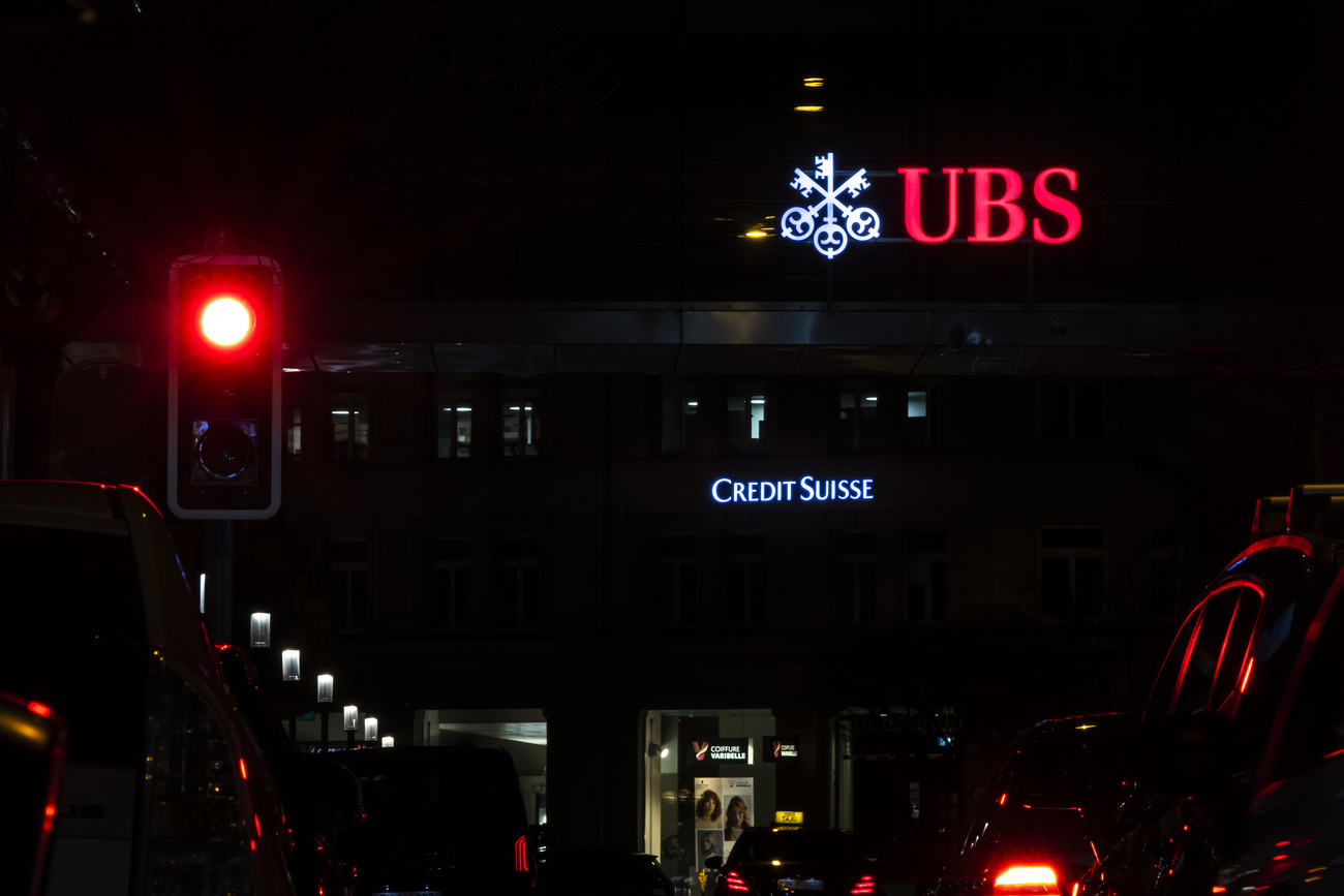 UBS and credit Suisse logos lit up at night