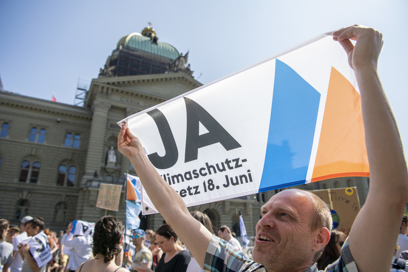 Several hundred people demonstrate for the climate and the adoption of the Climate Protection Act as well as against fossil infrastructures on Saturday May 27, 2023, in front of the Swiss federal palace in Bern.