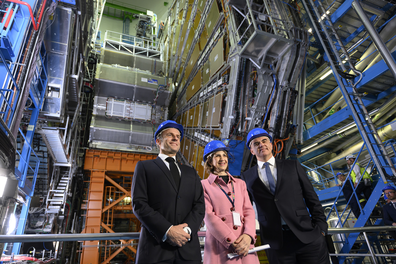 French President Emmanuel Macron, left, Fabiola Gianotti, centre, Director General of the European Organization for Nuclear Research (CERN), and Swiss President Alain Berset, right, pose for photographers in the ATLAS experiment, at the CERN (the European particle physics laboratory), in Meyrin near Geneva,, Switzerland, Thursday, November 16, 2023. French President Macron and his wife Brigitte are visiting Switzerland for a two day state visit.