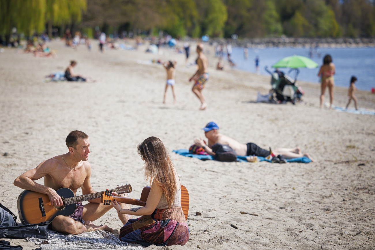 People on beach in Lausanne.