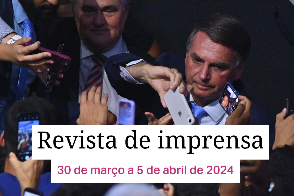 Homem cercado por celulares