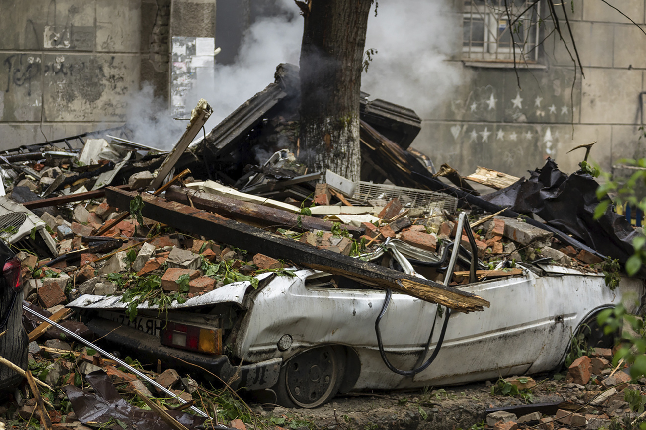 Car crushed under rubble in Ukraine