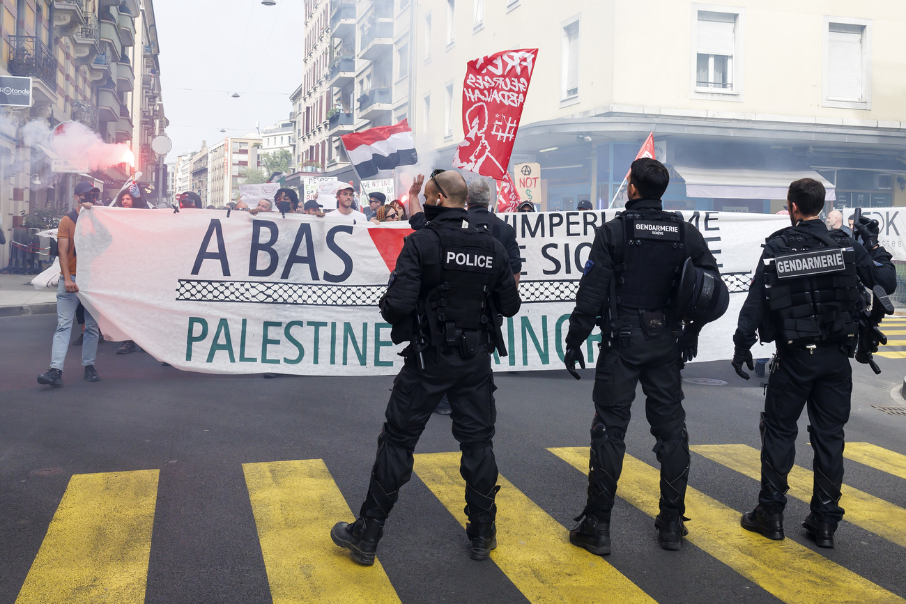 Police monitor a protest in Geneva