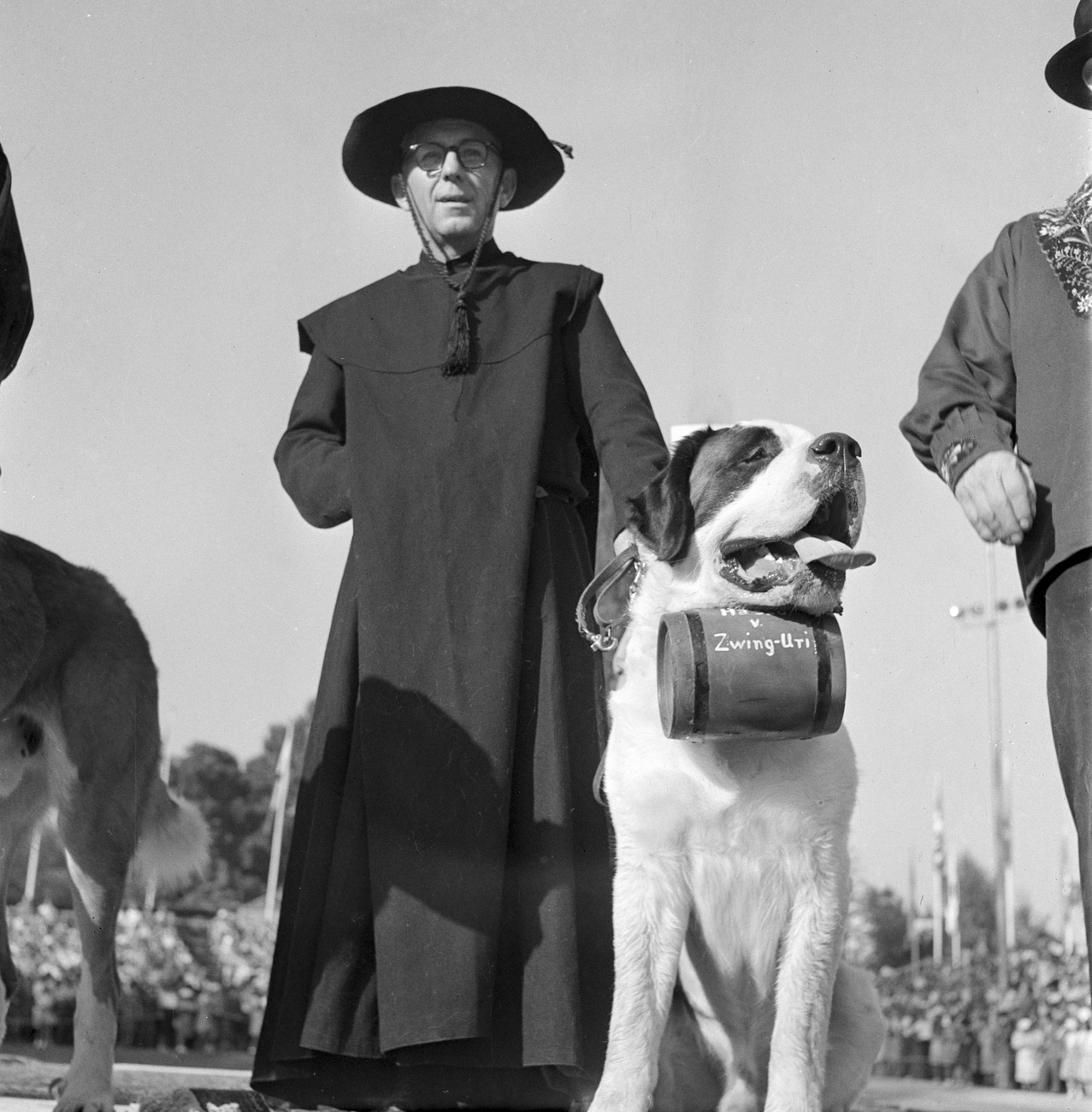 A monk with a St. Bernard, pictured in Switzerland, undated image.