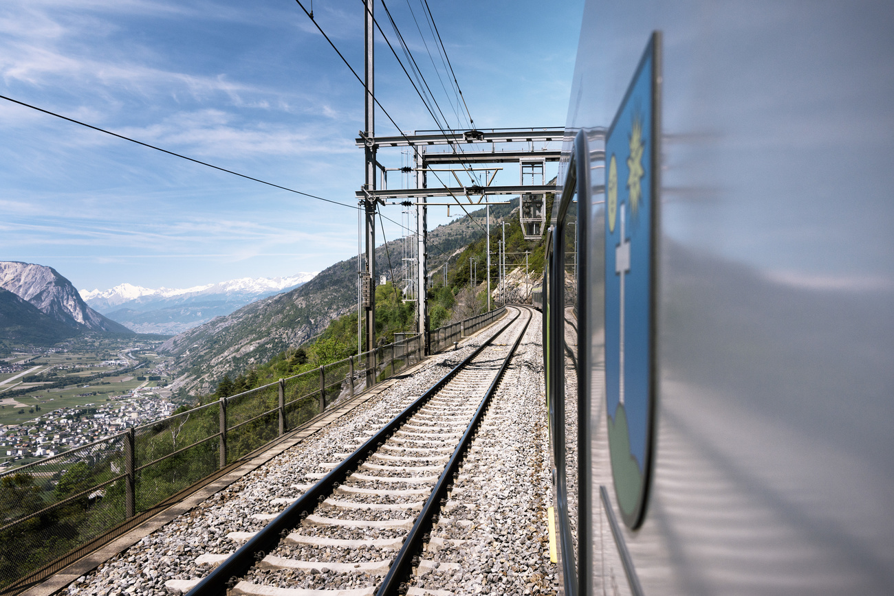 View onto the Loetschberg Base Tunnel's southern ramp, pictured from a BLS Bombardier Transportation low-floor multiple unit named "Loetschberger" of the type RABe 535, driving from Spiez, Canton of Berne, to Brig, Canton of Valais, Switzerland, on May 16, 2017.