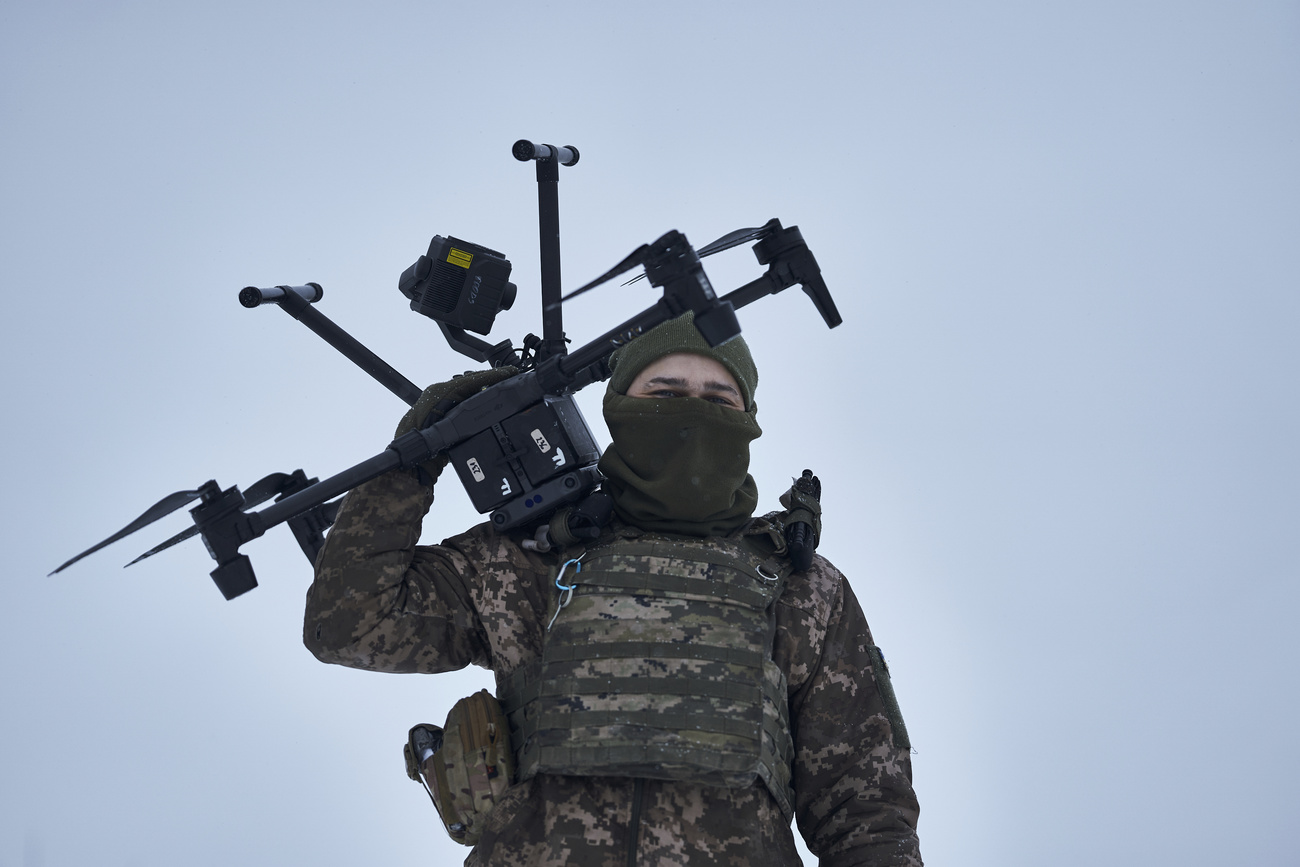 A Ukrainian soldier carries a drone close to the frontline near Avdiivka, Donetsk region, Ukraine.