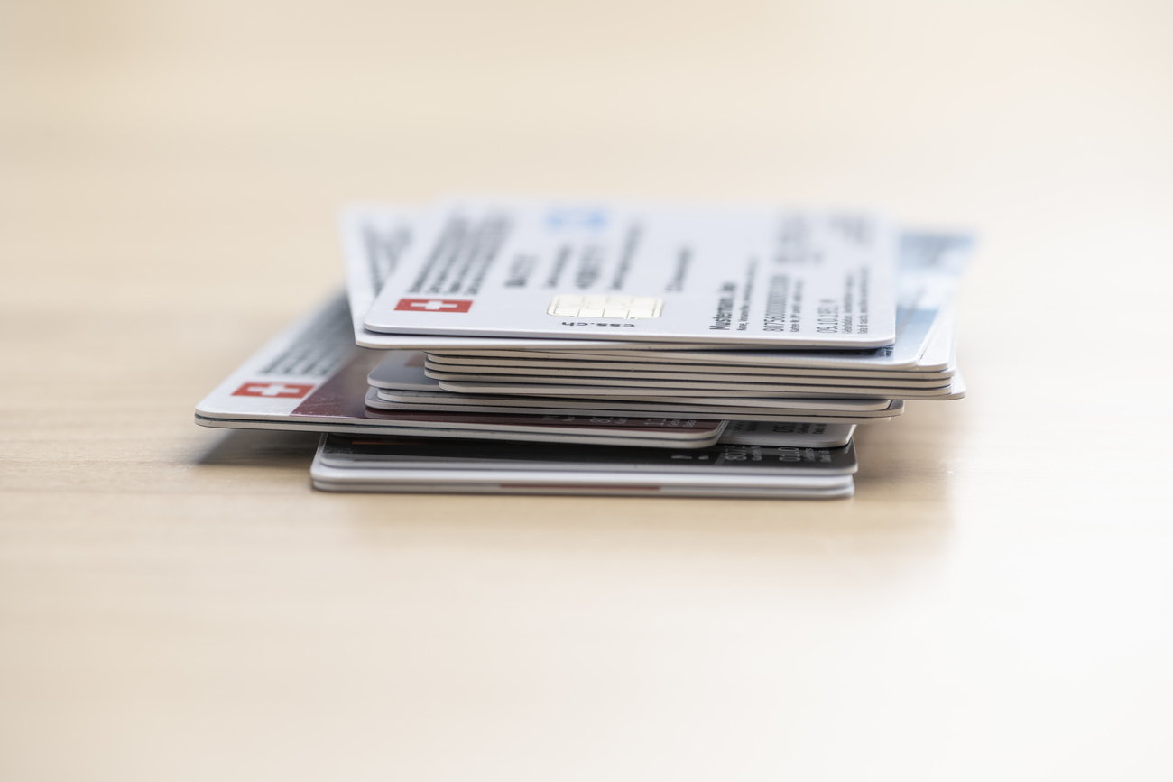 pila di tessere di cassa malati