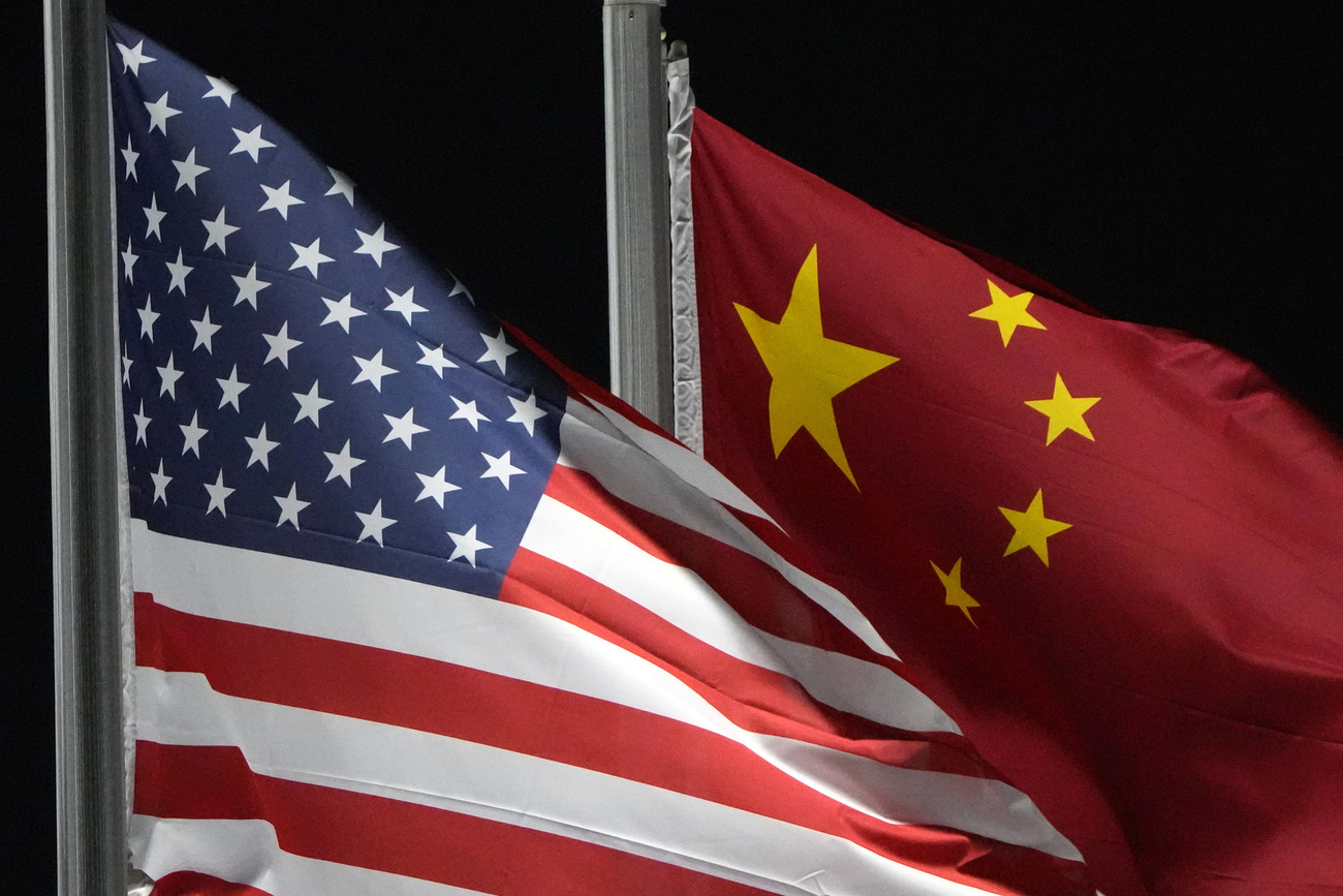 The American and Chinese flags wave