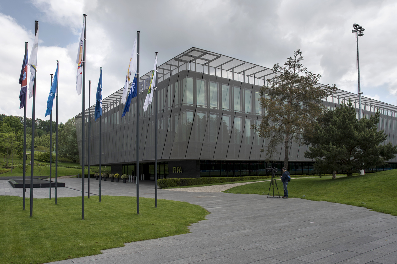 A view of a large glass-paneled office building.