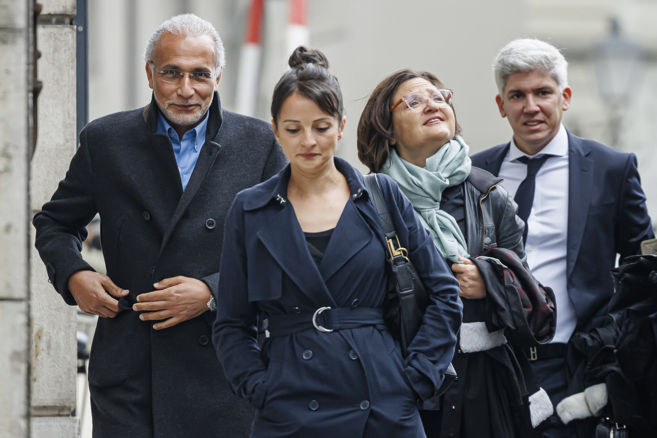 Famous Swiss Islamic scholar Tariq Ramadan (left) walking with his lawyers Nabila Asmane (2nd left), Yael Hayat (2nd right) and Guerric Canonica (right) at the Geneva courthouse for the appeal trial as part of a sexual assault investigation, in Geneva, Switzerland, Monday, May 27, 2024. (KEYSTONE/Valentin Flauraud)